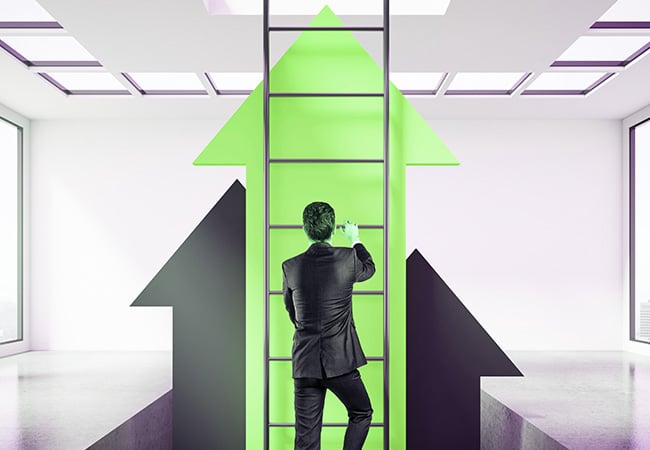 Man climbing a ladder to illustrate keeping ahead in business