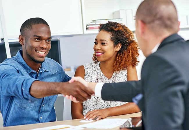 Customer shaking hands with a sales person