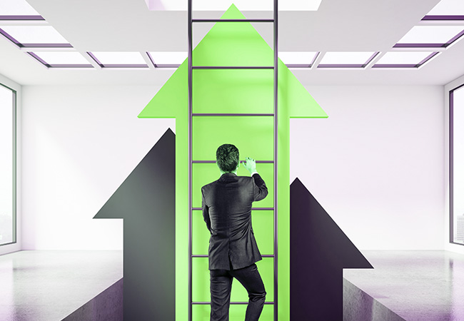 Man climbing a ladder to illustrate keeping ahead in business
