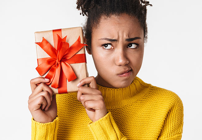 Person looking questionably at a gift