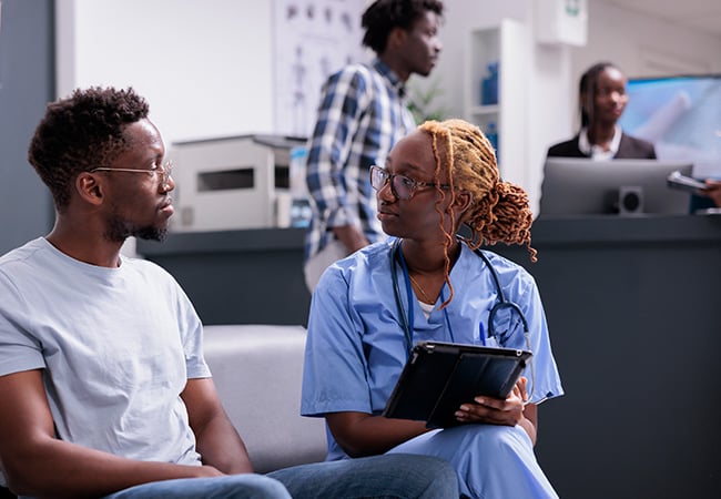 Nurse with a patient, asking questions