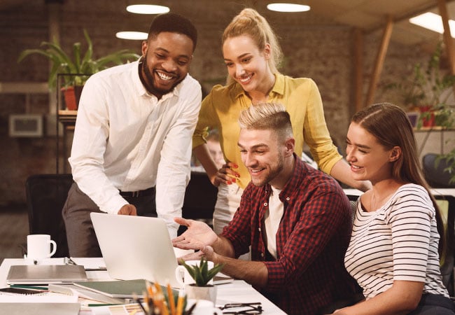 Team of people working happily together