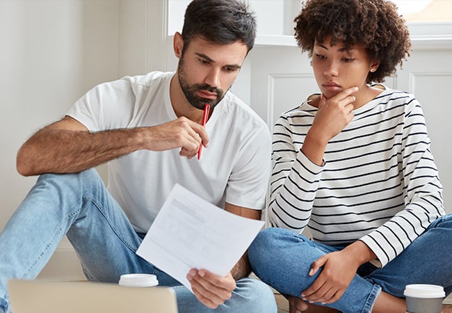 Millennial couple looking for insurance. 